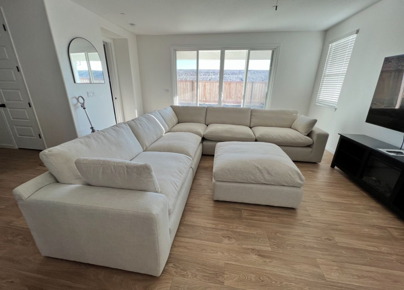 Extra large, deep seated Ashley sectional sofa with matching oversized ottoman.