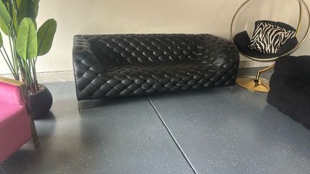 Two black sofa one lather