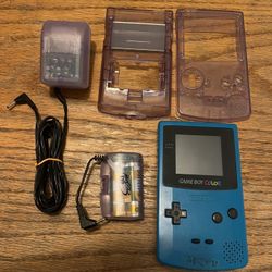 Nintendo Game Boy Color, Mad Catz Transparent Purple Power Plug & Rechargeable Battery Pack With New Batteries & Extra Casing