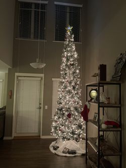 12 Foot - Pre-Lit Snow Flocked Artificial Pencil Christmas Tree