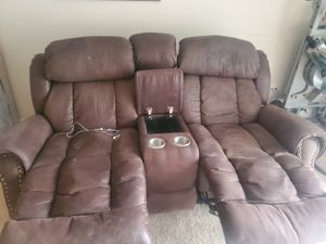 Photo Two seater couch with storage and cup holder