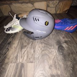 Two Sets Of Cleats For Football Or Baseball And One Baseball Helmet 