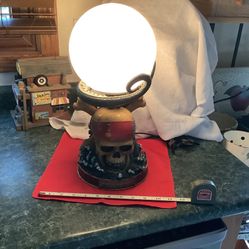 Disney Pirates of the Caribbean Sculptured table lamp. “At World’s End Skull and Kranken Lamp. On off switch with 72” cord, 16” tall, 9” in diameter h