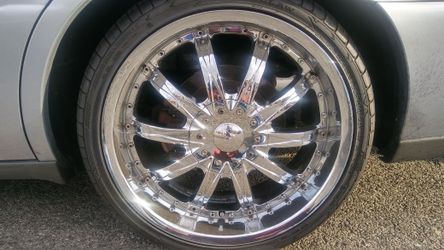 Four 20 inch rims with new tires