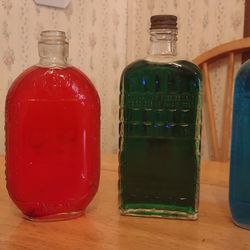 7 ANTIQUE ORNATE BOTTLES!!! COLOR ADDED TO WATER TO SHOW DESIGNS!!! 9