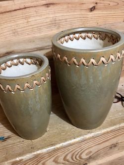 2 heavy stone like planters