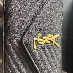 Purse , Trousers , sunglasses