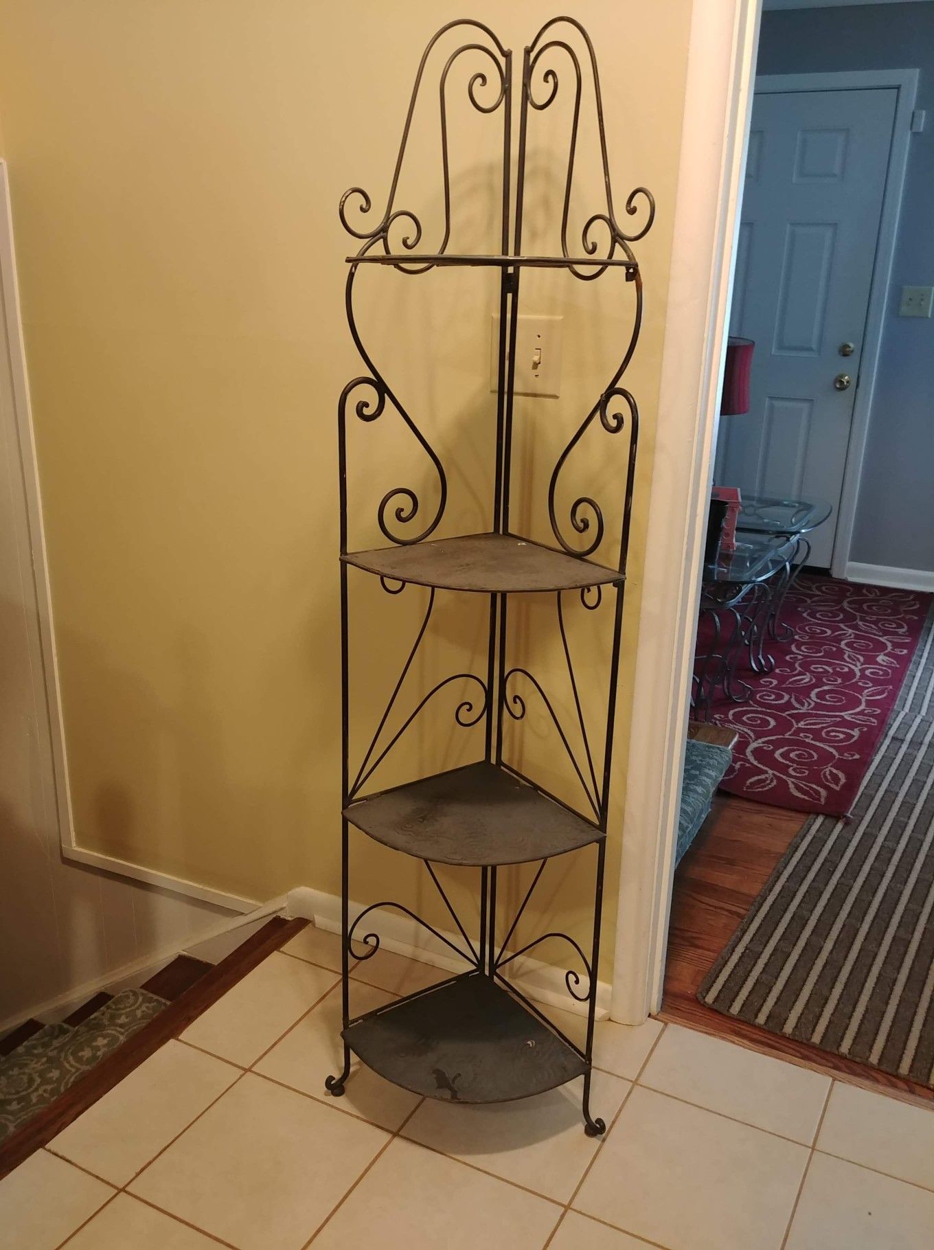 Outdoor metal corner shelf.