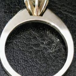 1 CT, AND A WHITE GOLD SETTING, SILVER LIKE  SETTING AS WELL