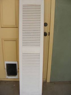 A Pair of Cathedral Open Louver Vinyl Shutter