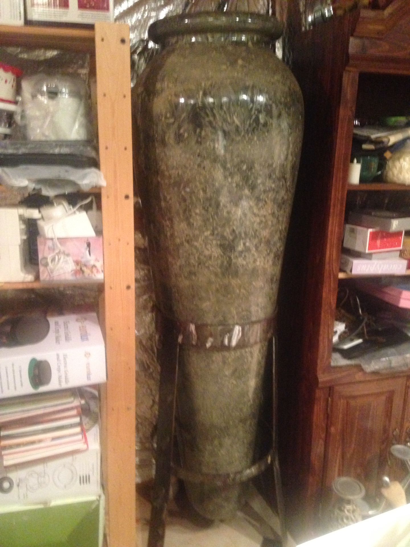 6ft. Tall vase with wrought iron stand. Very good condition. Cash only, non smoking, no delivery.