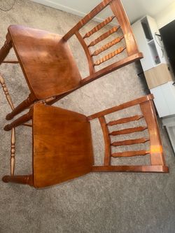2 brown high chairs