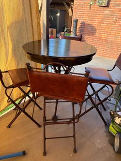 Comedor antique de piel y Herrera
