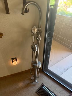 Stand alone bathtub faucet with shower head