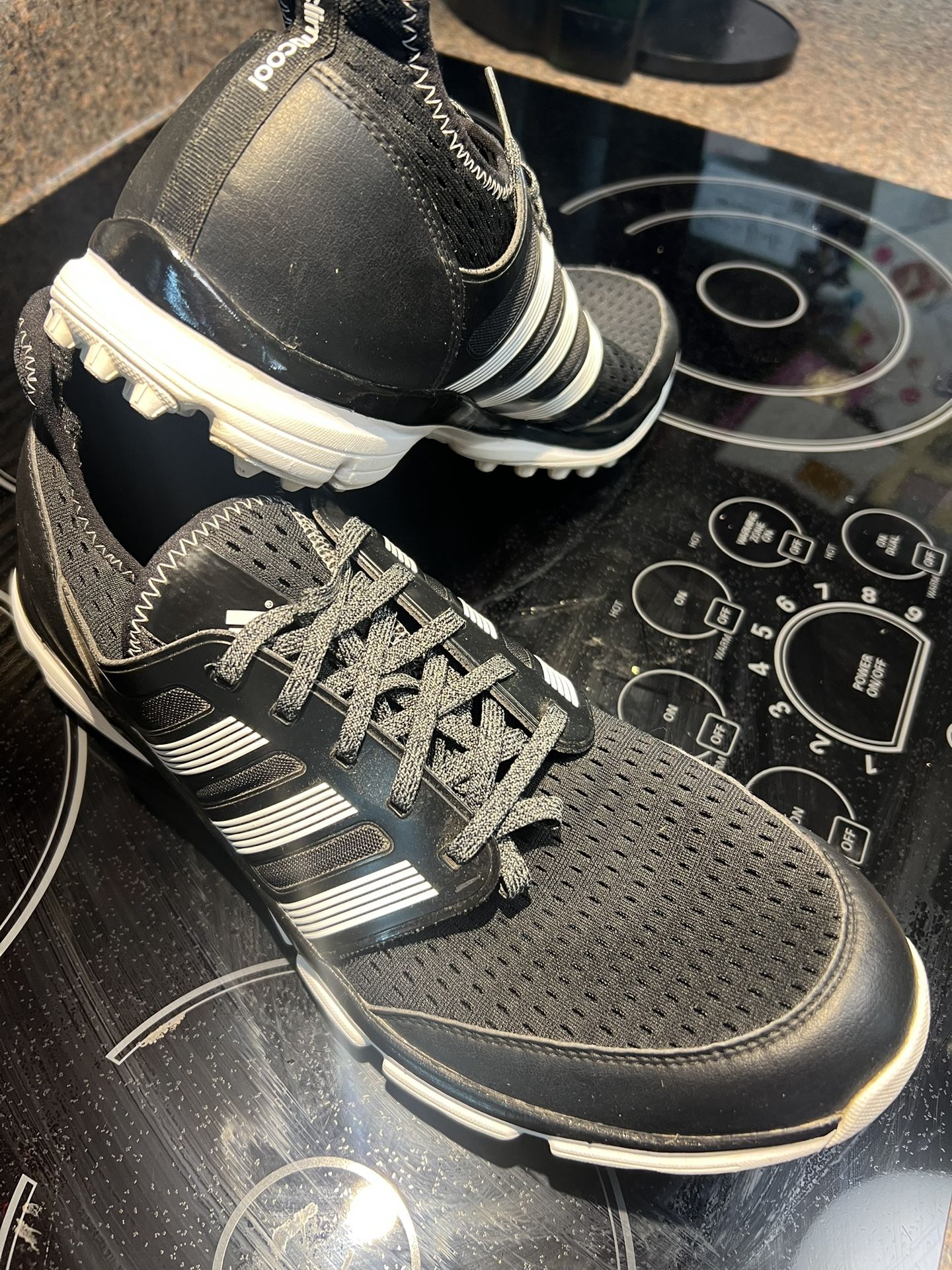 golf shoes, Addidas, super lightweight with an interior sock for GR88 stability. with gripping soles. Size size 13, but fits as a size 12 . Spikeless