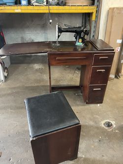 Vintage Singer Sewing Machine with cabinet and seat
