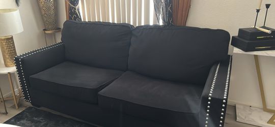 Black sofa and love seat