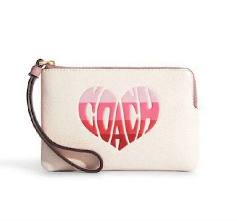COACH CORNER ZIP WRISTLET WITH STRIPE HEART MOTIF IN GOLD / PINK / CHALK MULTI