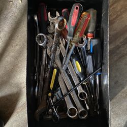 A large tub of wrenches and screwdrivers