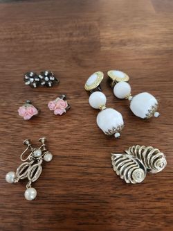 Five pair of vintage clip or screw on earrings.
