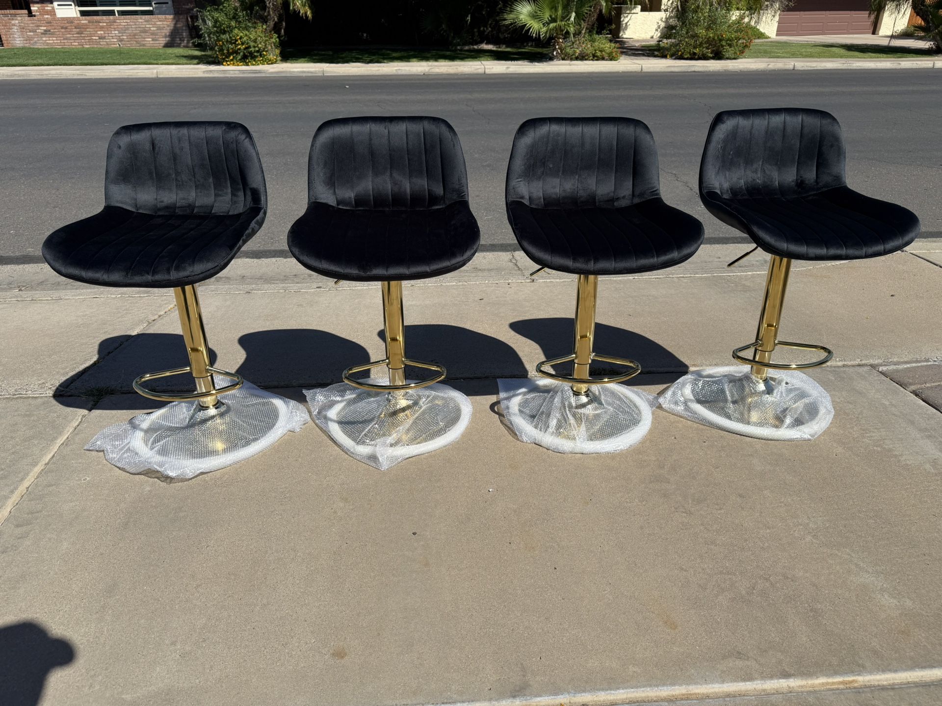 Black and gold adjustable barstools Only 85$ Each
