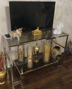 Chrome and glass TV stand 30 inches high x 47 wide