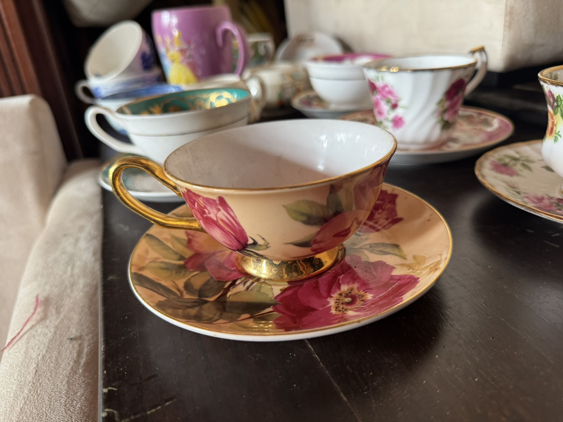 The Aynsley Bone China Pink Cabbage Roses Gold Footed Tea Cup & Saucer is a vintag