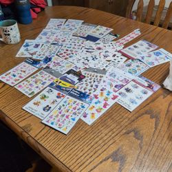 Pile Of Stickers And Tattoos