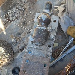 The item in the image is a heavy-duty combination hitch featuring both a pintle hook and a trailer ball mount