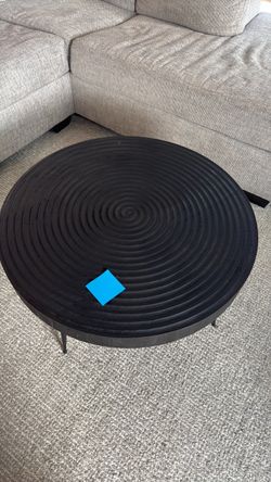 Round Black Coffee Table with Spiral Relief