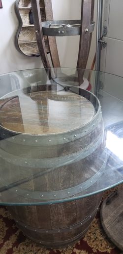 Wine Barrel With 20 Inch Long Glass Top Which Is Very Thick,, With A Lazy Suzie And 4 Stools All Is Weathered Perfectly, But Could Use A Stain.