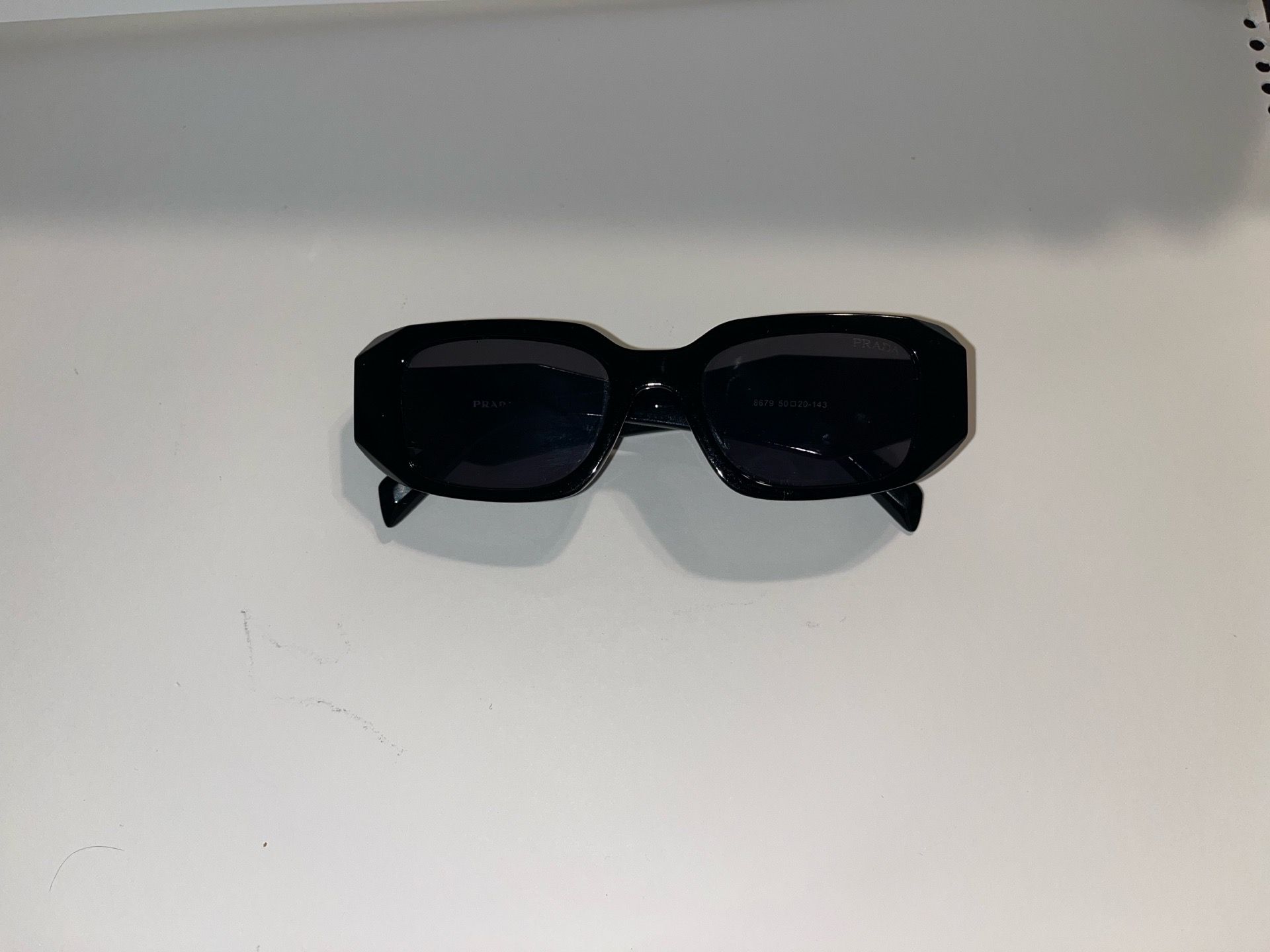 Black unisex PRADA glasses