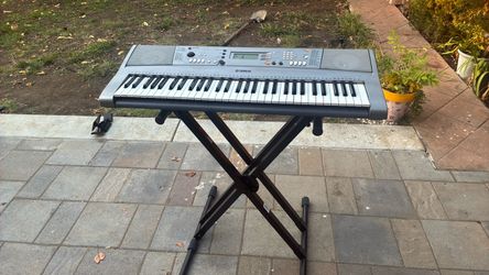 Yamaha piano with stand