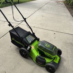 Greenworks 48V Cordless Lawn Mower – 20” Deck – Brand New Brand new, never used. Comes with battery, charger, grass bag, and protective cover. Clean a