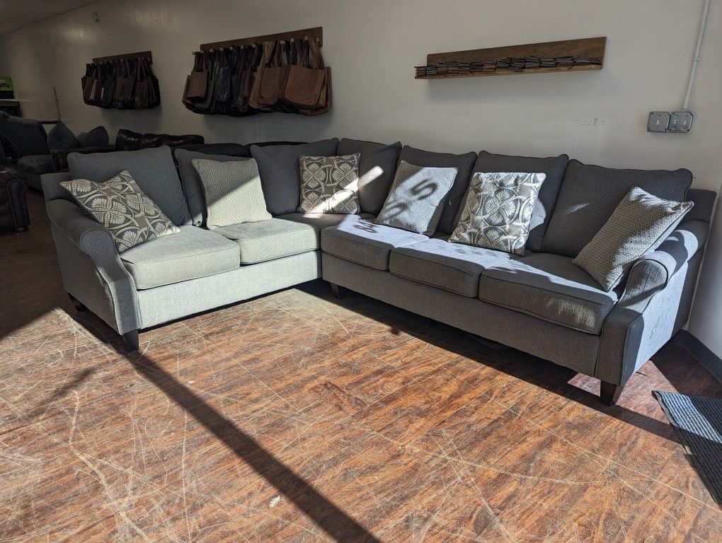 Grey Fabric Sectional with Throw Pillows