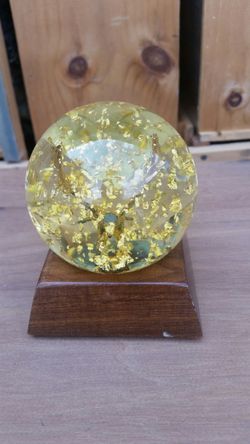 24 K Gold Eagle globe with walnut base. Made by Golden Rain in Denver Co. Makes a beautiful collector or desk piece.