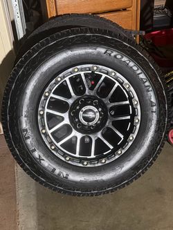 Silverado , Toyota rims and tires like new 265/70 r18 set of 4