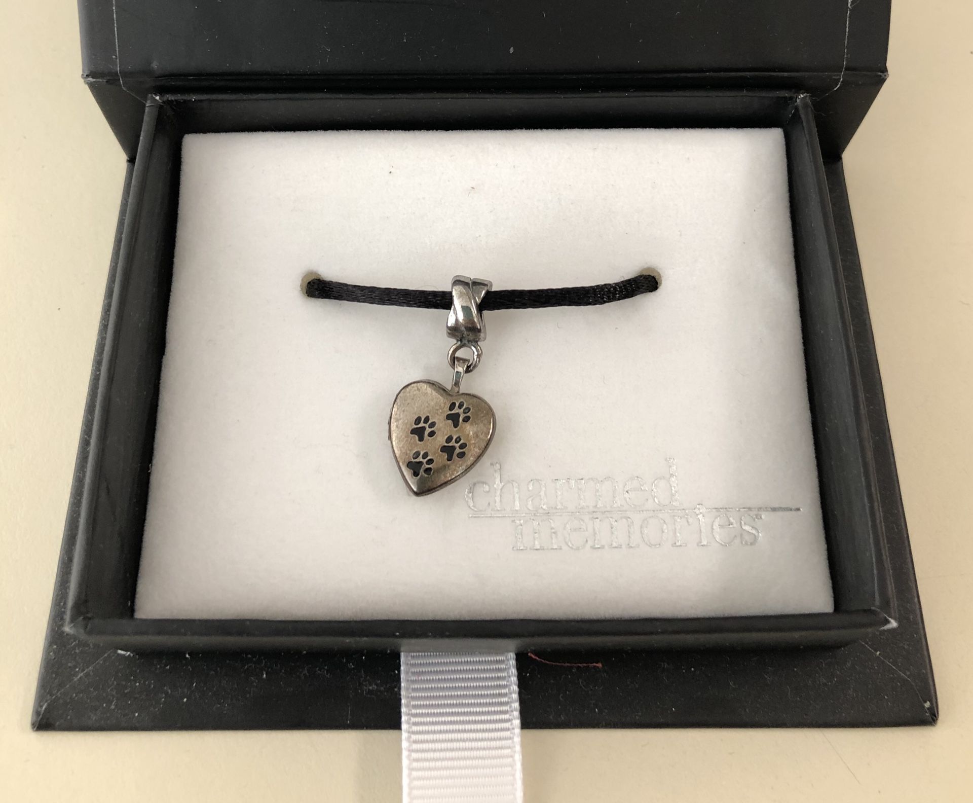 Kay Charmed Memories Paw Print Locket Charm, never been worn or used.