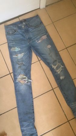 Amiri Distressed Skinny Jeans with Patches