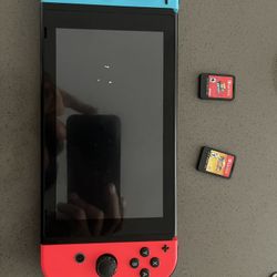 Nintendo Switch and 2 games
