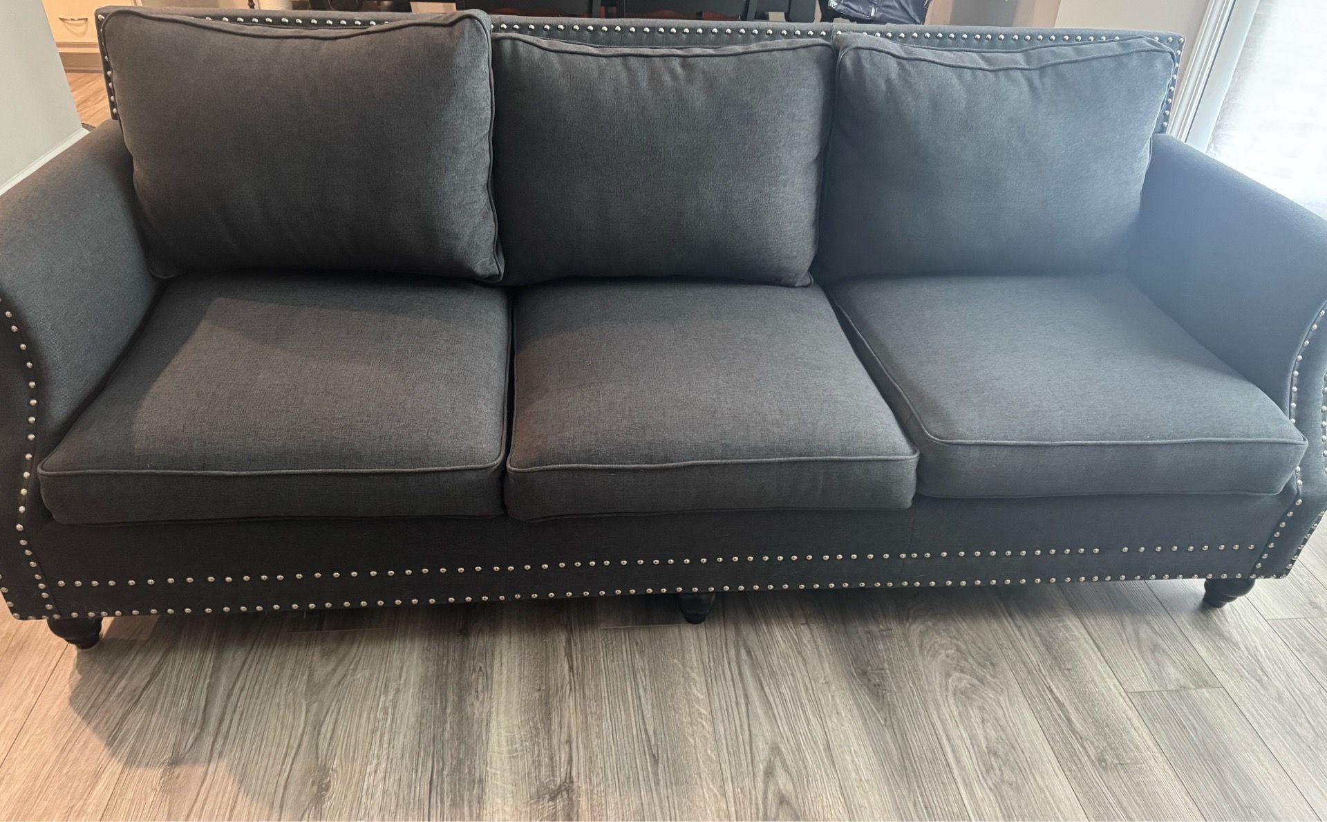 Gray studded couch