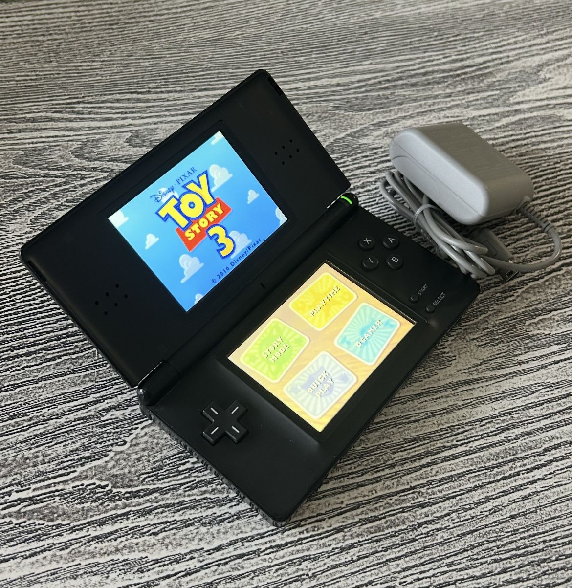 Nintendo DS with a game, complete with stylus & charger. $40