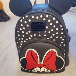 Disneyland Minnie Mouse loungefly backpack 

