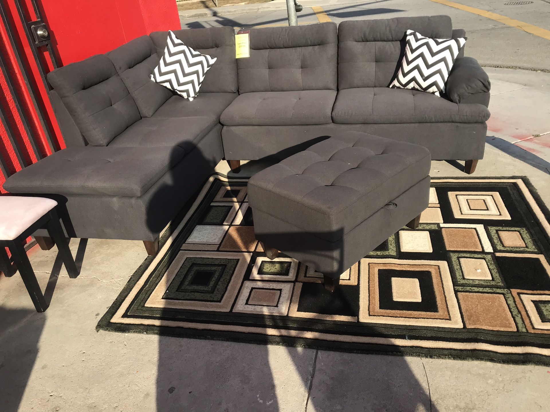 π€ Black sectional with storage chaise @ JORDAN HOME FURNITURE & ELECTRONIX π€