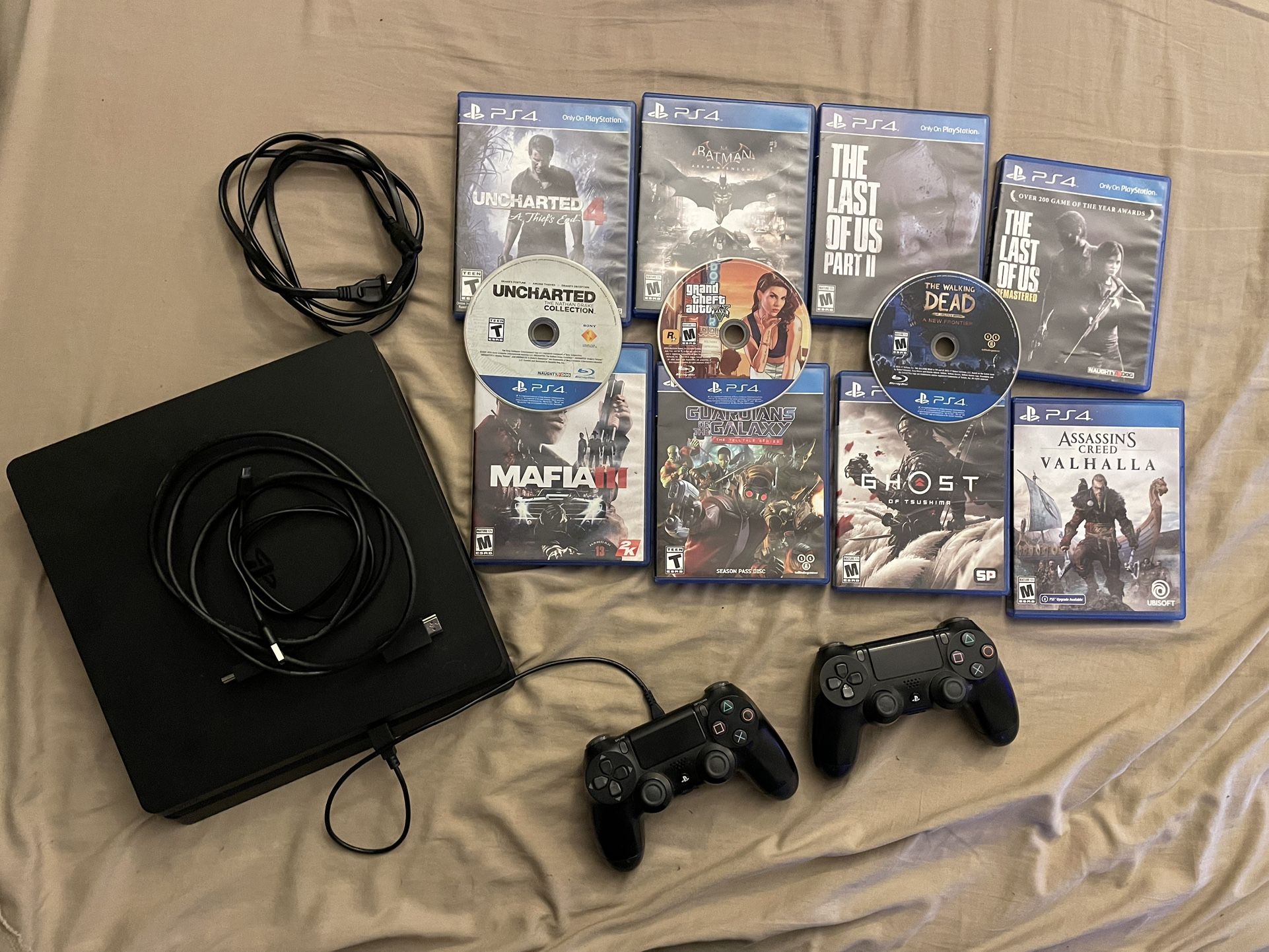 PS4 (500GB) w/ 2 PS4 DualShock Controllers + 11 Games