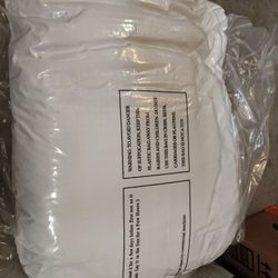White mattress pad vacuum sealed, size unknown