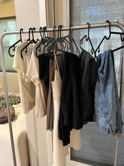 silver metal rolling clothing rack