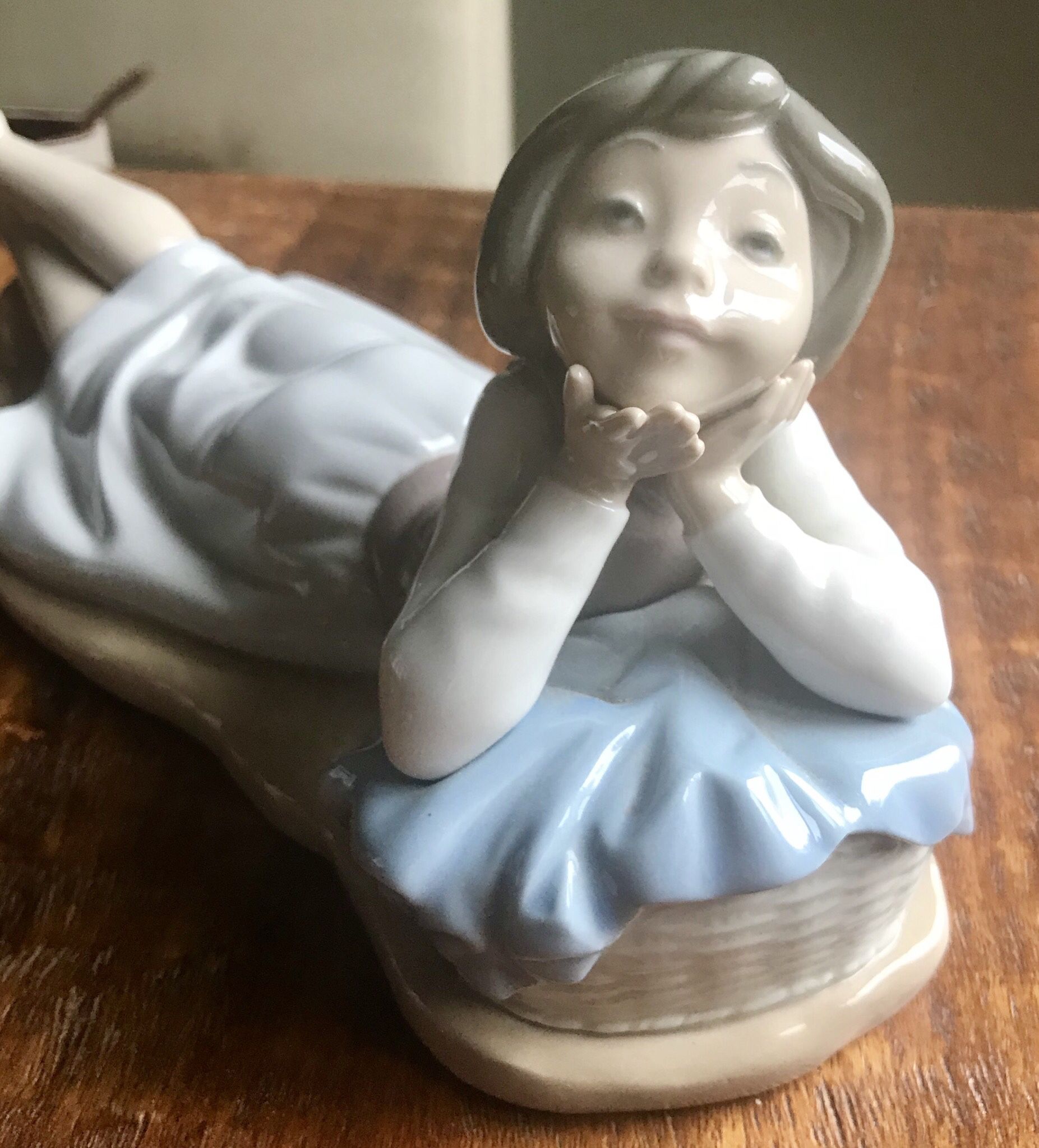 Lladro Figurine “Girl Laying Down”. 