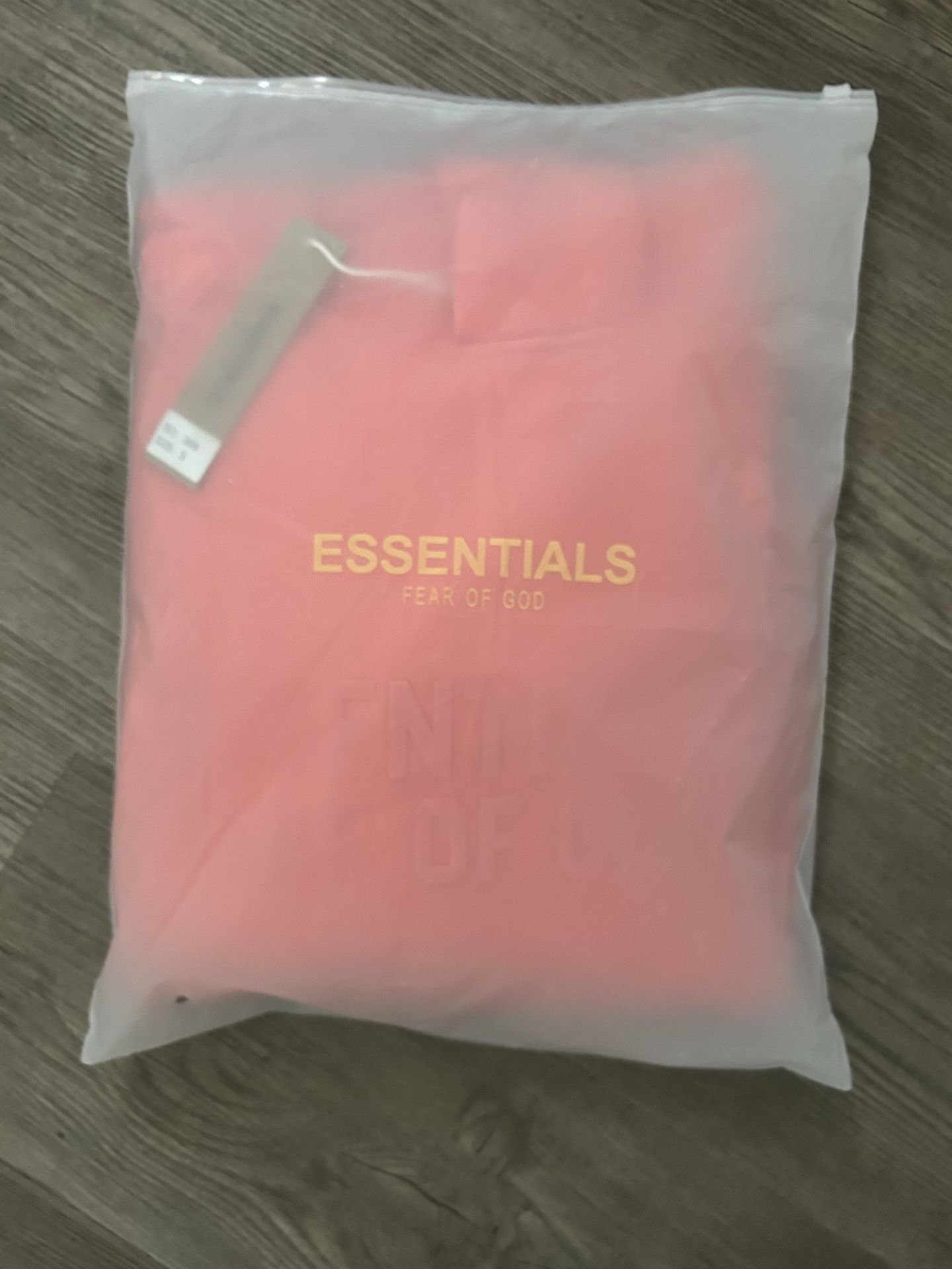 coral essential fear of god hoodie