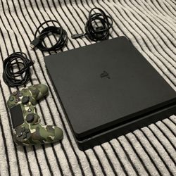 PS4 With Controller, Charger, HDMI Cable, Power Cable.